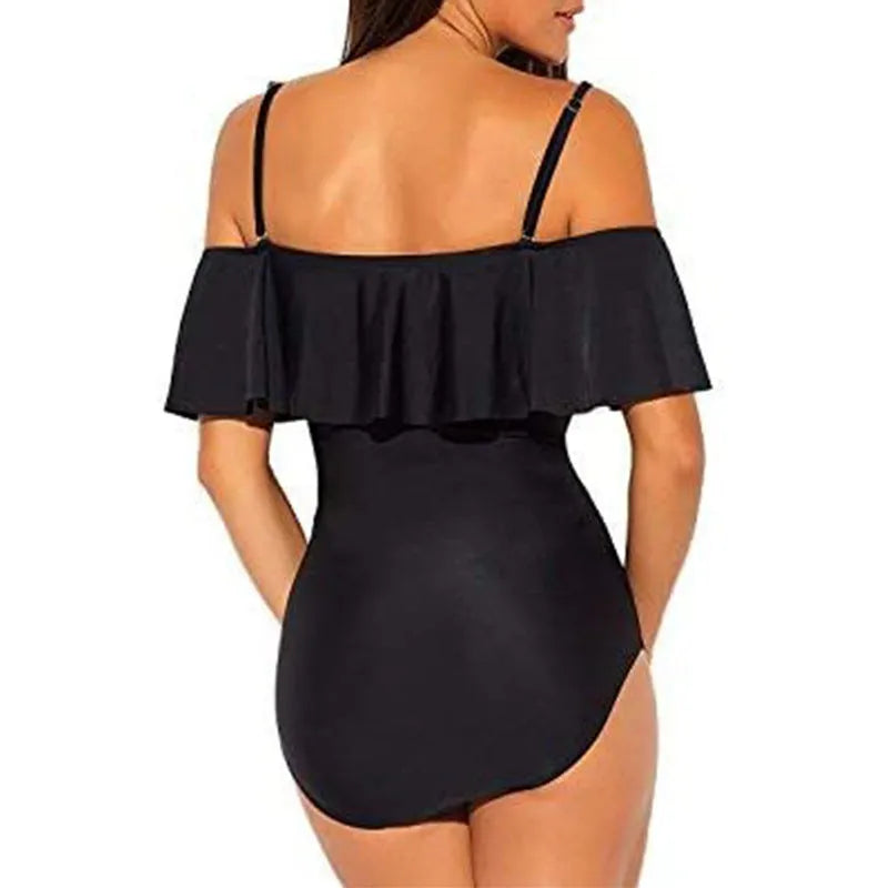 Black one-piece swimsuit with side cut-outs and ruffled shoulder straps on a mannequin