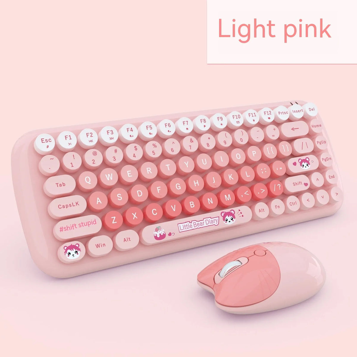 Candy pink mini wireless keyboard and mouse set with USB receiver on a desk.
