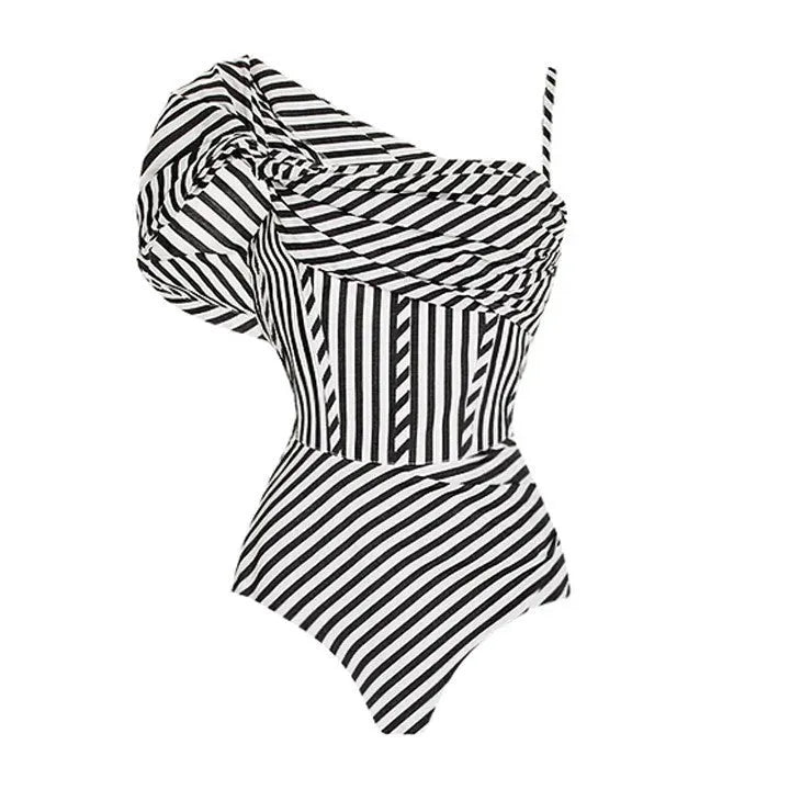 Women's striped one-piece swimsuit with black ruffle skirt detail for beach and pool wear
