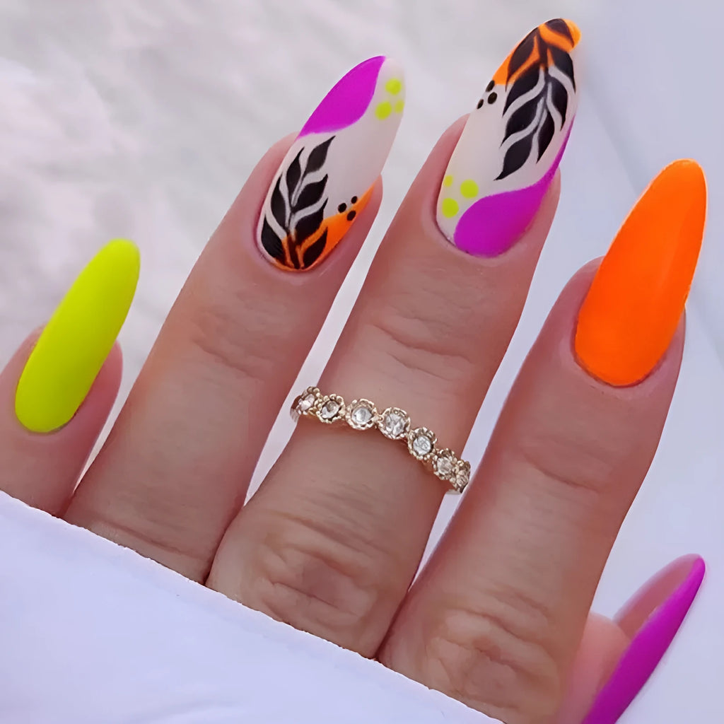 Wear Armour medium almond shaped frosted nail stickers showing four different designs including French leaves and leopard print
