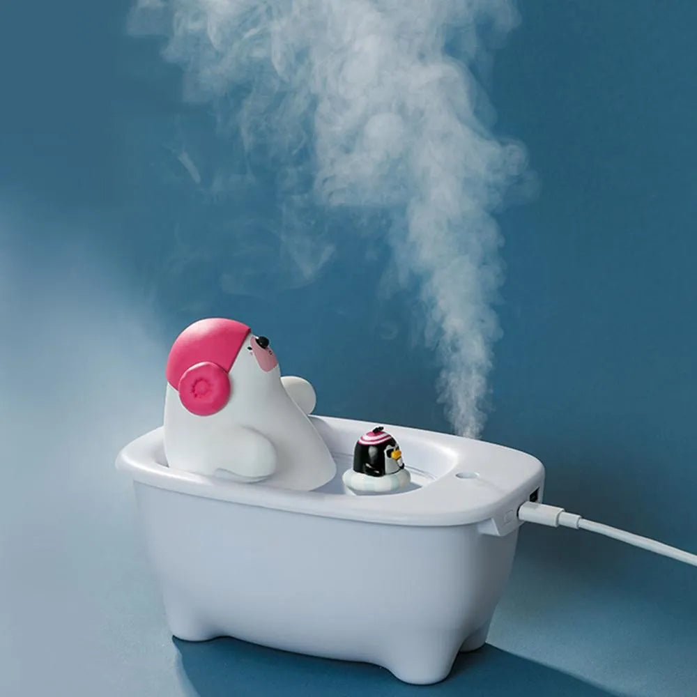 White USB air humidifier and scent diffuser with large water tank on a desk.