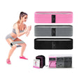 Set of three fabric resistance bands in lake blue, pink, and purple colours with a net storage bag.