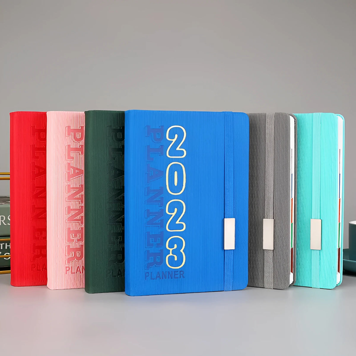 Creative student almanac calendar with imitation leather cover, open to show weekly schedule layout.