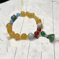 Carved bodhi root bracelet with pumpkin lotus beads and white jade lotus detailing in multiple bead sizes
