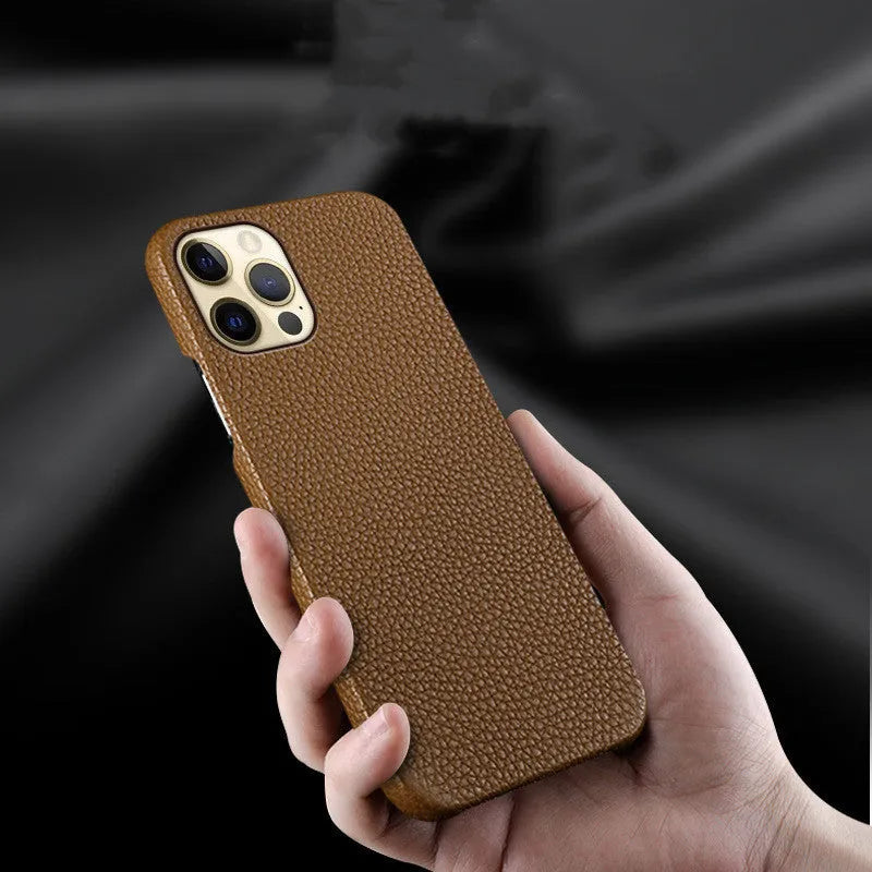 Genuine leather half-frame protective case for iPhone on a table in beige colour.