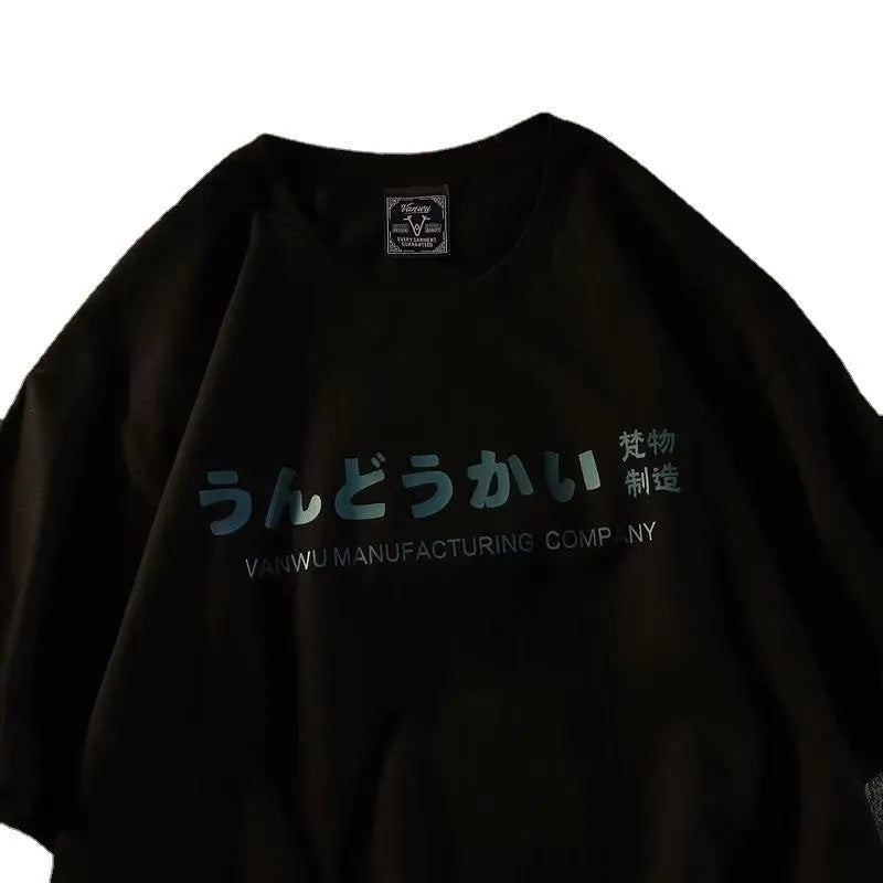 Loose fit black cotton t-shirt with a printed letter pattern on the front.
