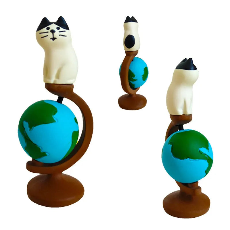 Cartoon resin cat statue dressed as Statue of Liberty holding travel globe, Earth Instrument Cat and Carp Cat style variants.