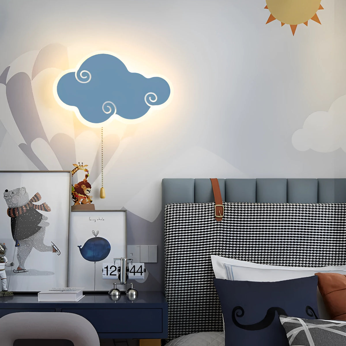 Creative cloud-shaped white acrylic children's bedside wall lamp mounted on a blue wall.