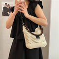 Knitted tote beach bag with bucket shape and contrast stitching in black or brown colour
