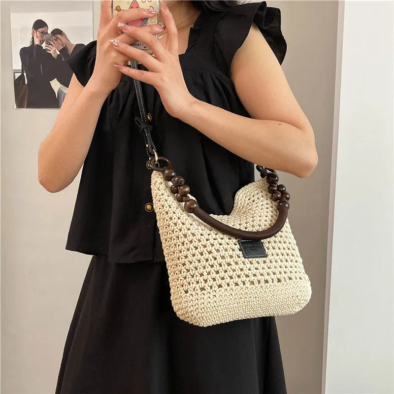 Knitted tote beach bag with bucket shape and contrast stitching in black or brown colour