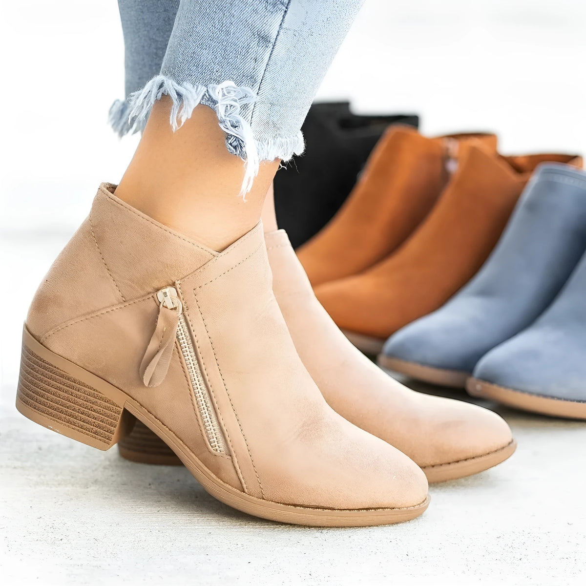 Women's suede Dr Martens-style ankle boots with side zip and chunky heel in blue.