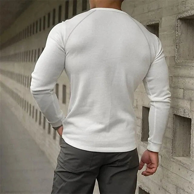 Men's long sleeve henry collar t-shirt in white, black, and navy blue on a size chart