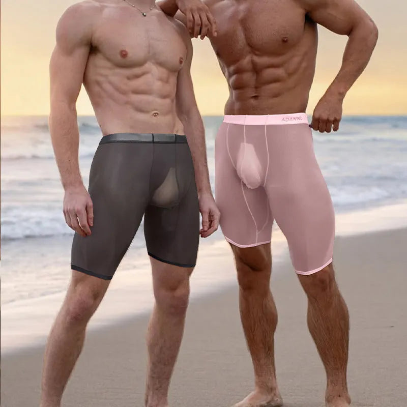 Men's seamless nylon mesh home shorts in black, shown in a casual setting.