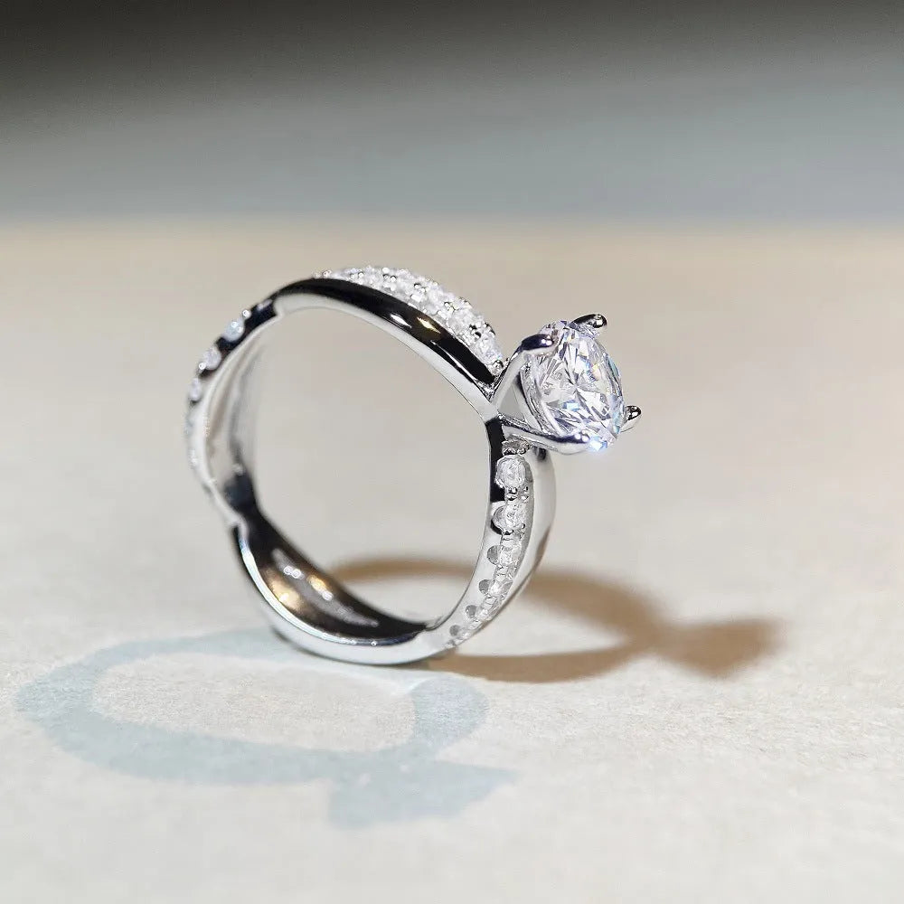 Silver twisted arm ring with a 1 karat moissanite stone in a four-claw setting.