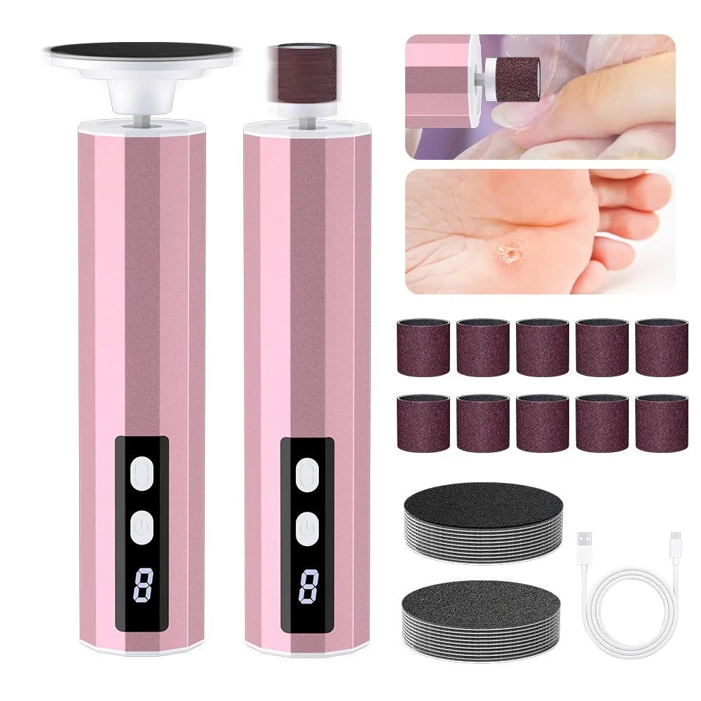 Pink USB-powered electric callus remover tool with sandpaper discs on a table.