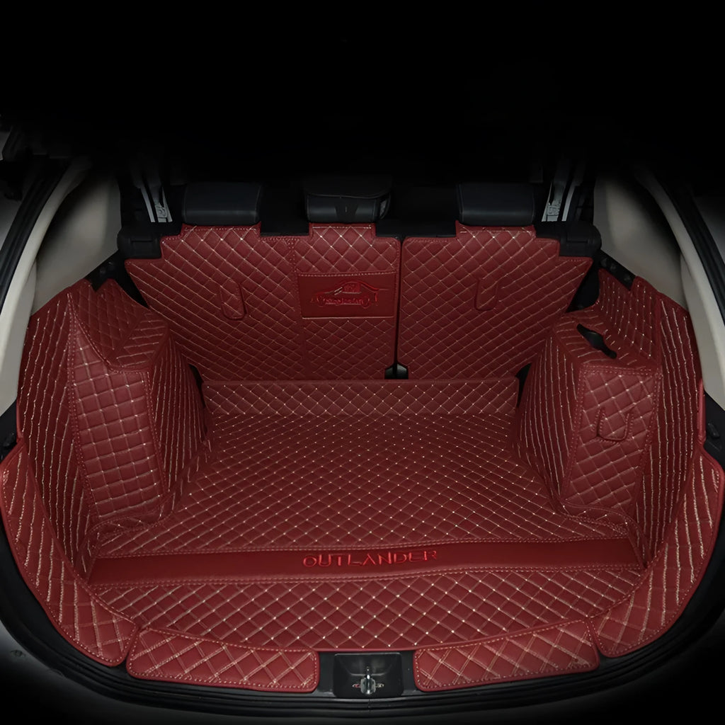 Tailored TPE XPE boot liner fitted in a Mitsubishi Outlander, showing full coverage and raised 3D edges.