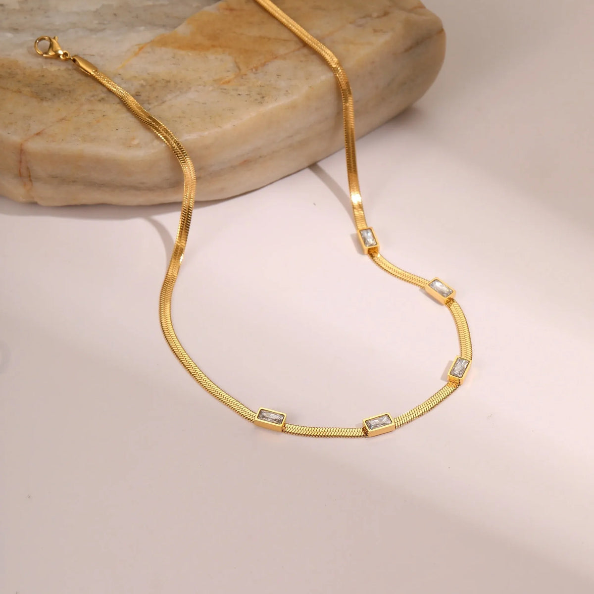 Geometric square zircon necklace on stainless steel flat snake chain with gold electroplated finish