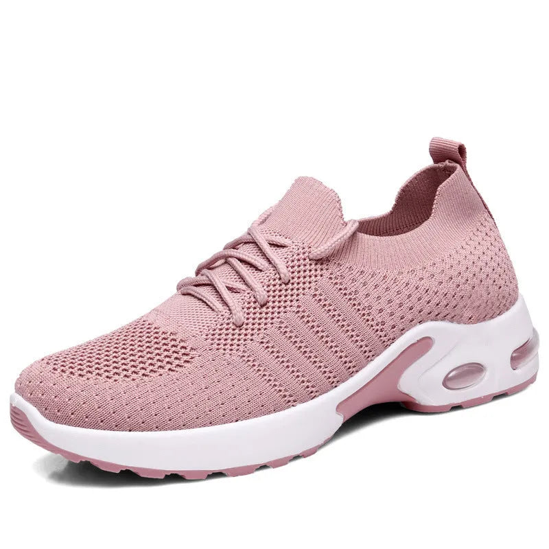 Women's round-toe lace-up sneaker in grey mesh with a soft PVC sole.