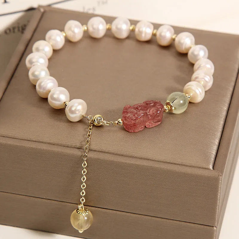 Women's multi-strand crystal bracelet with garnet, pearl, quartz, and jade pendants in Korean style design.