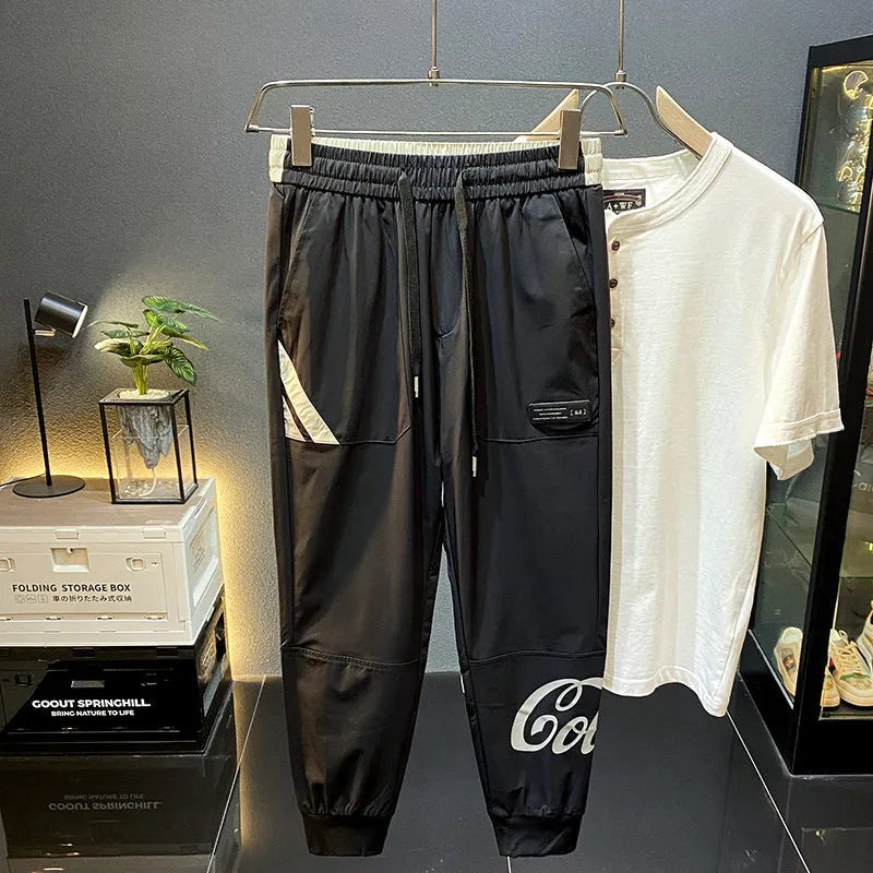 Black men's cropped casual trousers with ankle band, made from ultra-thin ice silk fabric.