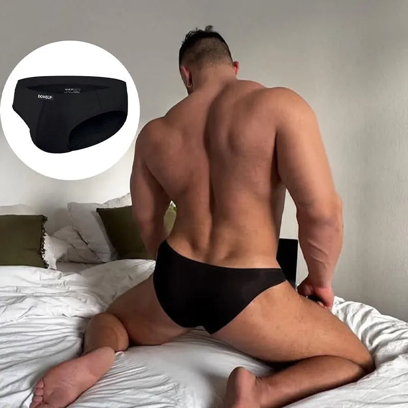 Men's solid colour low-waist seamless briefs in white, black, and pink on a size chart