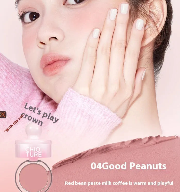 Compact of shimmer powder blush in a nude shade from a four-colour palette.