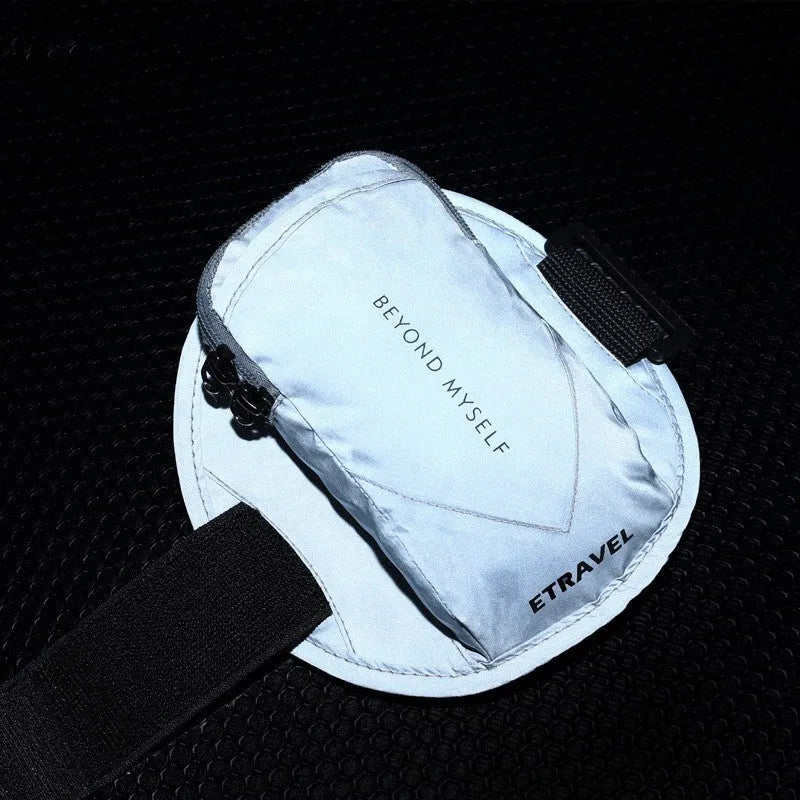 Reflective running arm bag with 7-inch capacity shown in black with reflective strips for night safety