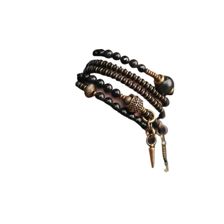 Geometric black beaded bracelet with multi-layered construction and colourful detailing