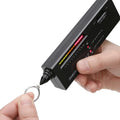 Black handheld second generation diamond thermal conductivity meter on a grey background.