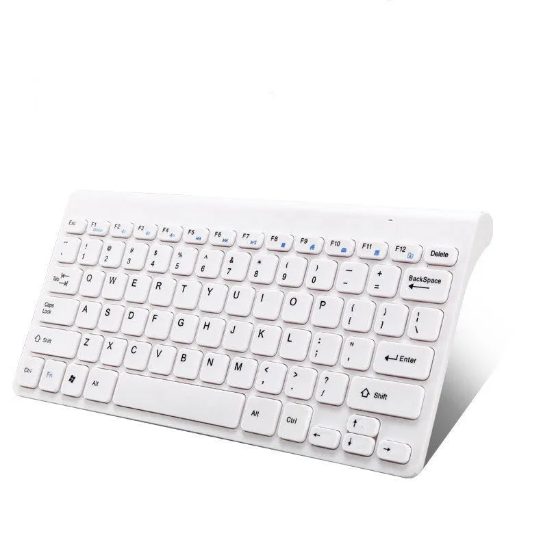 Black and white wireless keyboard and mouse set with USB receiver on desk