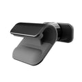 Black gravity car phone holder with 360-degree rotation on a car dashboard