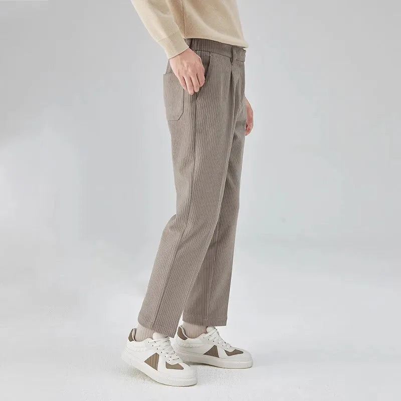 Corduroy straight-leg men's trousers in beige colour showing texture detail