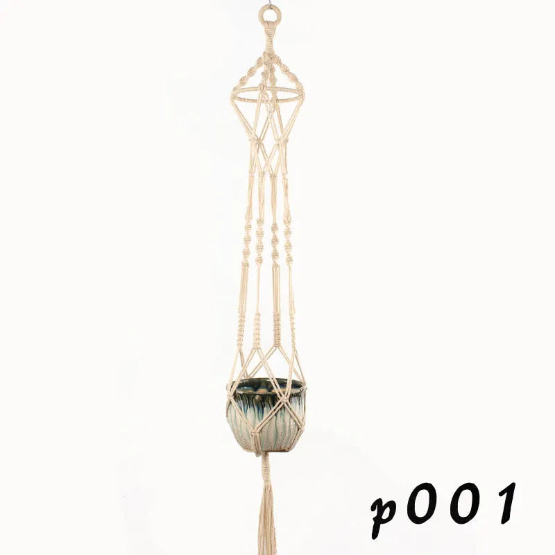 Woven cotton rope plant hanger in wall hanging configuration with green plants