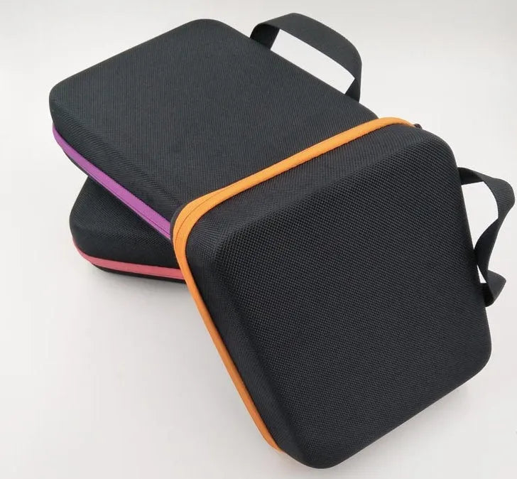 Red EVA cube-shaped essential oil storage bag holding 30 bottles, mounted on a wall.