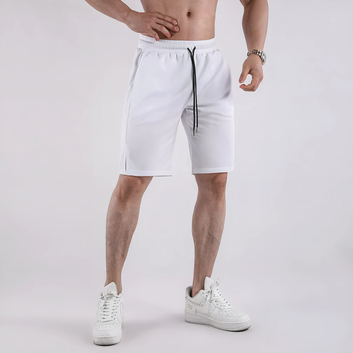 Men's black quick-drying mesh capri shorts with an elastic mid waist on a white background.