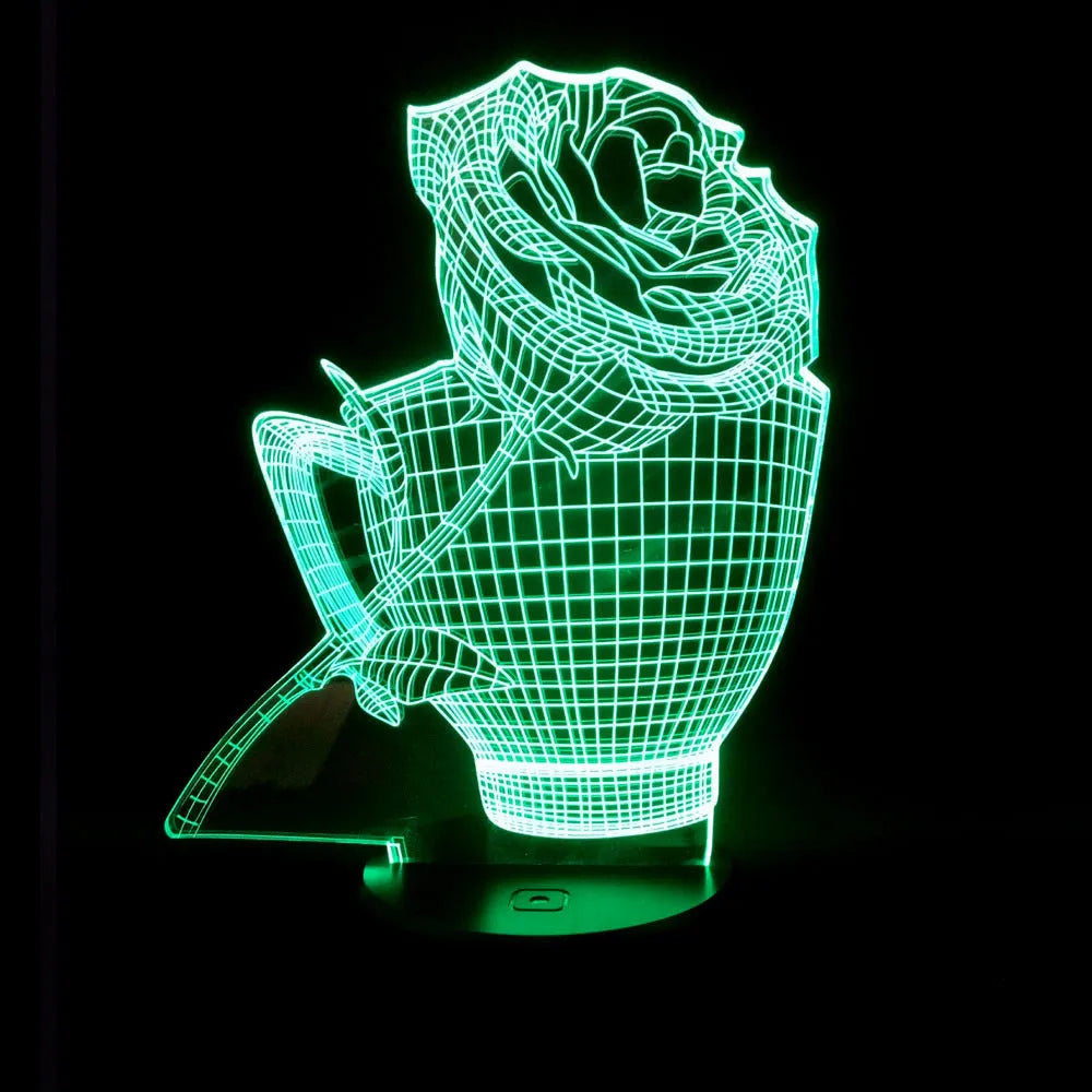 3D rose flower shaped night light with glowing LED colours on a black base, showing remote control.
