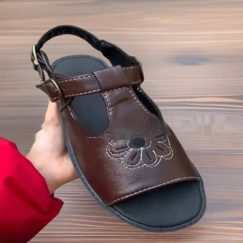 Men's black embroidered beach sandals with floral pattern and flat slip-on design