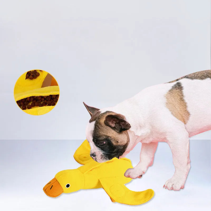 Yellow plush duck dog toy with squeaker and food leak compartment for treats.