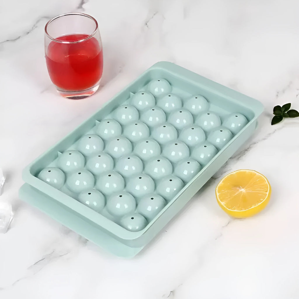 Blue silicone ice cube tray with 33 round grids and integrated lid showing 24x14x3cm dimensions