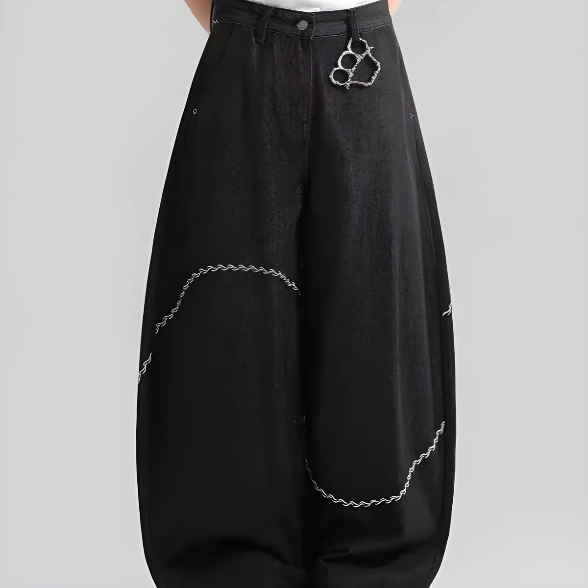 Black straight-leg denim trousers with a mid-waist and zip fly on a plain background.