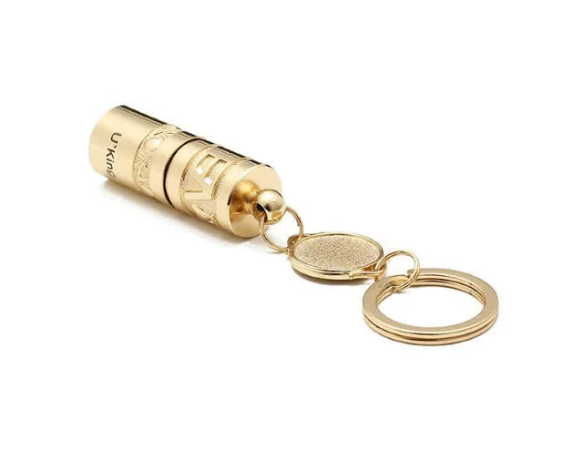 Gold-coloured zinc alloy mini LED keychain flashlight with a keyring.