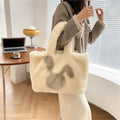 Plush shoulder bag with cartoon rabbit ears in solid colour with shoulder strap