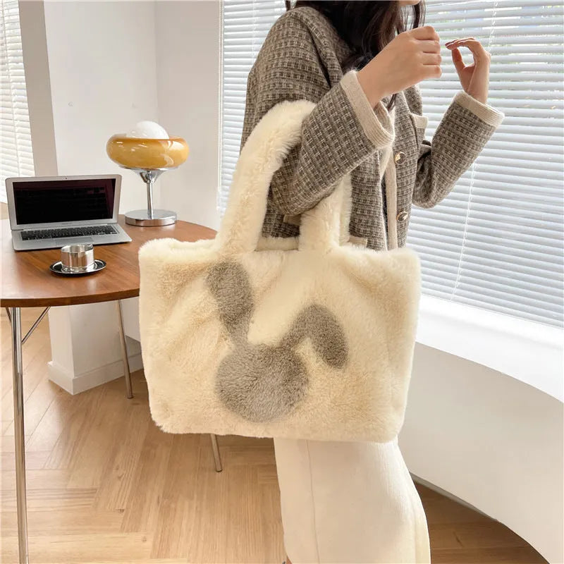 Plush shoulder bag with cartoon rabbit ears in solid colour with shoulder strap