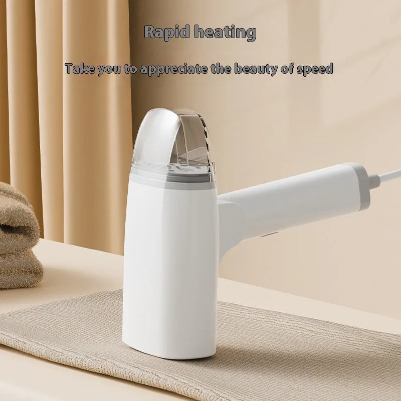 Blue and white handheld garment steamer with water tank and nozzle.