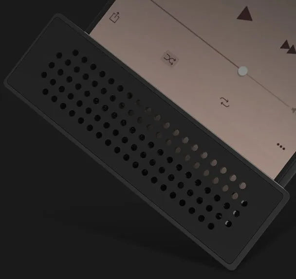 Mini black ABS mobile phone amplifier bracket holding an iPhone on a desktop.
