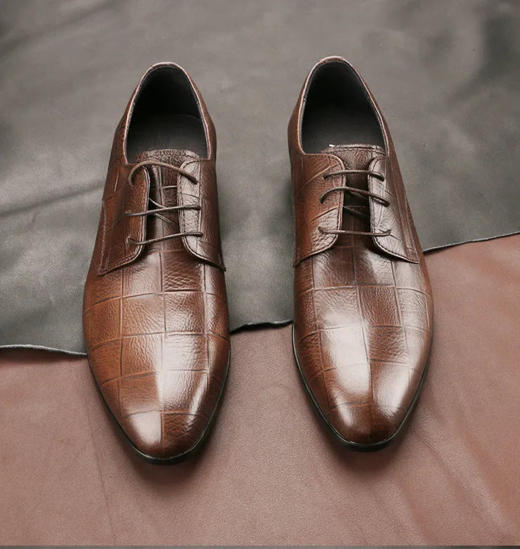Men's black handmade cow leather derby shoes with pointed toe and checkered sewing pattern on a rubber sole.