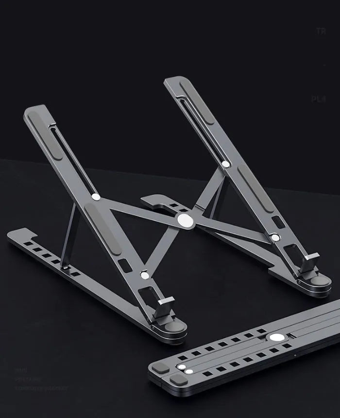 Silver aluminium laptop stand in folded and unfolded positions next to a 15-inch laptop.