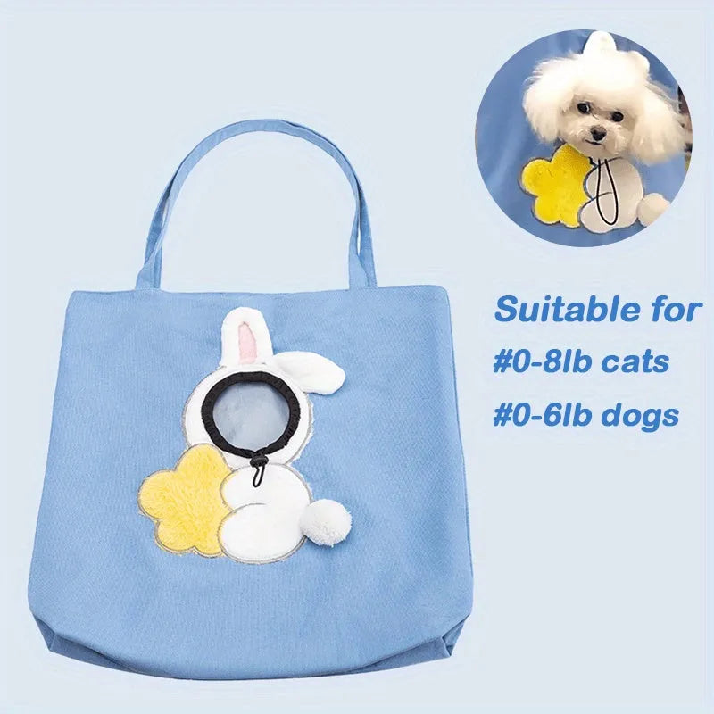 Little Bee Design canvas pet carrier shoulder bag in blue with animal pattern and adjustable side opening.