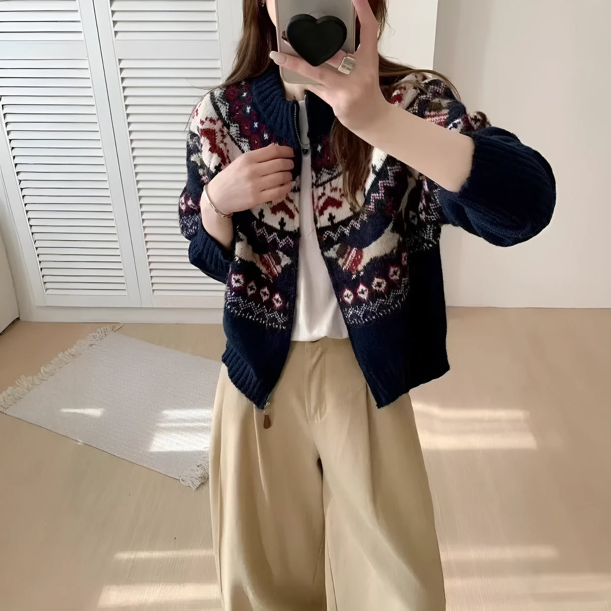 Apricot ethnic jacquard pullover sweater with 3D pattern, showing loose fit and long sleeves.