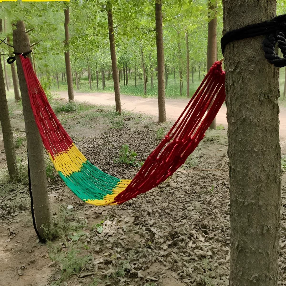 Nylon rope mesh outdoor hammock showing bold pattern construction with tying equipment